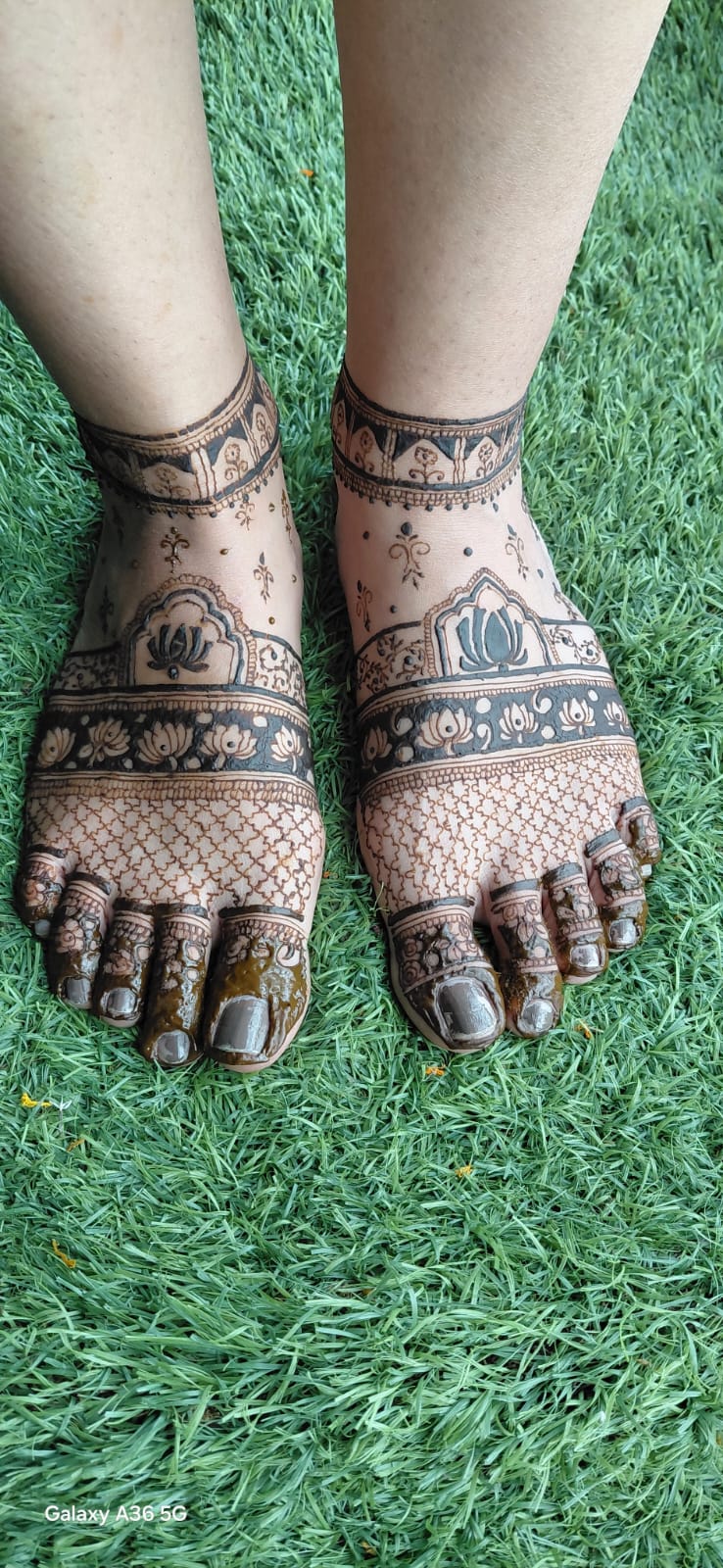Feet mehandi design with lotus flowers